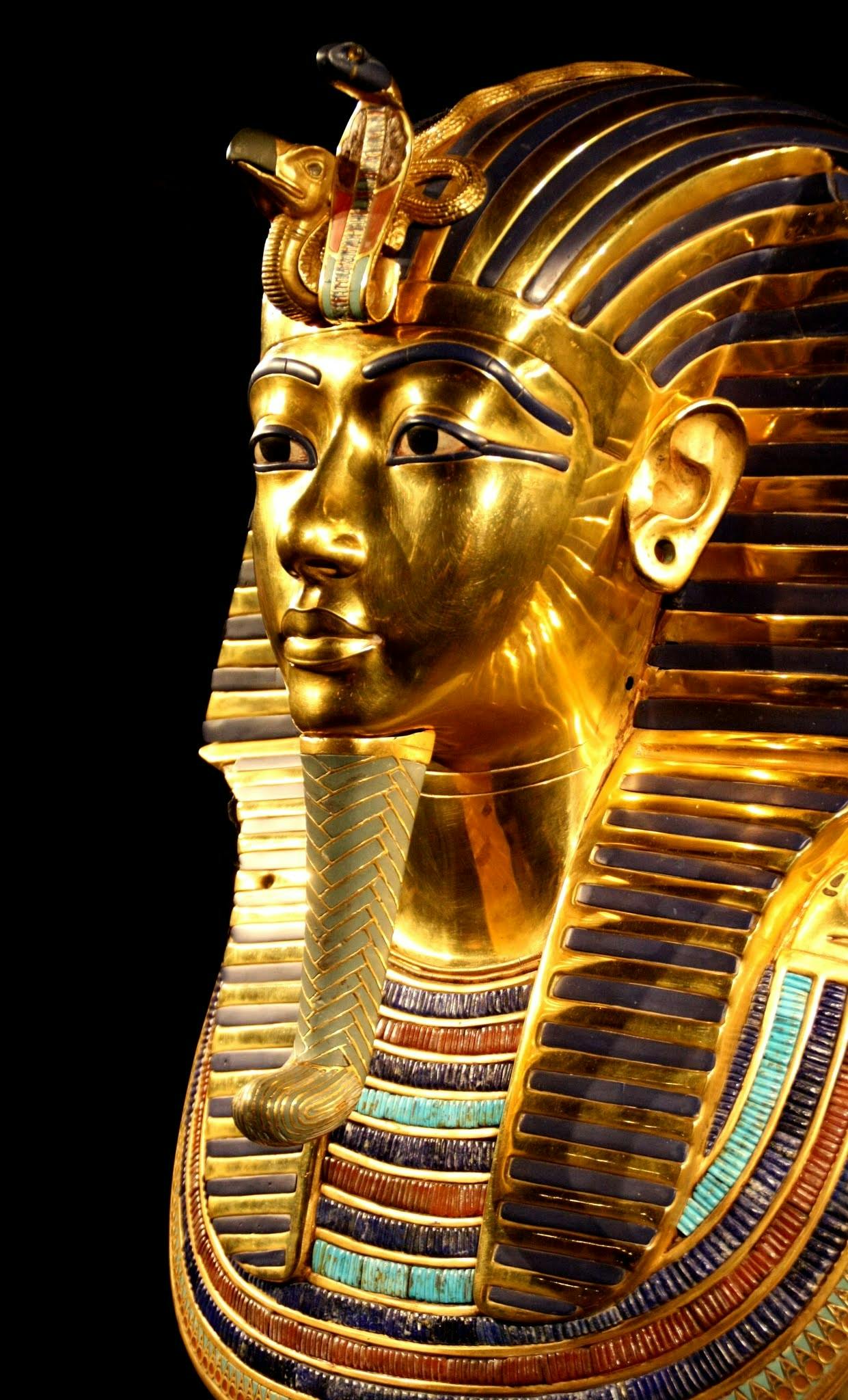 Close-up of Tutankhamun's gilded death mask showcasing intricate design.